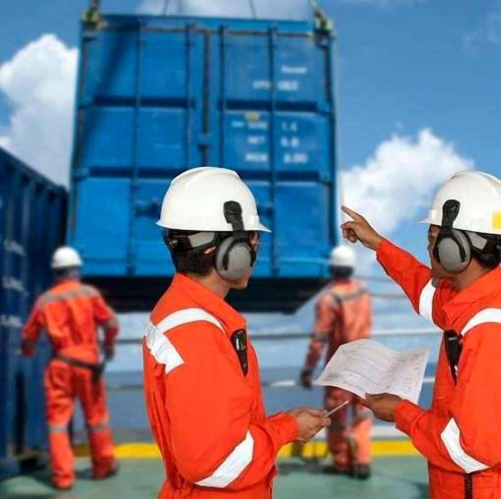 Offshore crew supervising a container lift